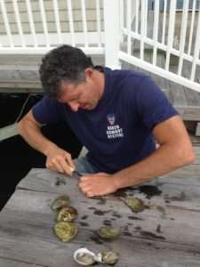 Chris Quartuccio, opening some of his Blue Island oysters